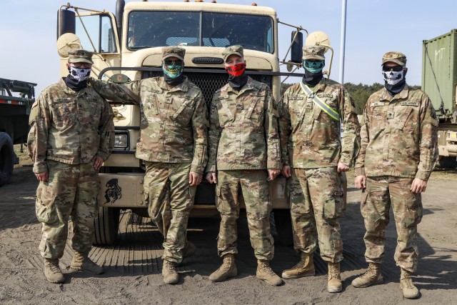 U.S. Army Reserve truck drivers from 724th Transportation Company out of Bartonville, Illinois, pose for a picture in front of an M915 tractor trailer April 28 at Drawsko Pomorskie Training Area, Drawsko Pomorskie, Poland. The 724th is deployed to Poland, where they transport fuel and supplies to Army base camps throughout the country. (U.S. Army Reserve photo by Master Sgt. Ryan C. Matson, 652nd Regional Support Group)