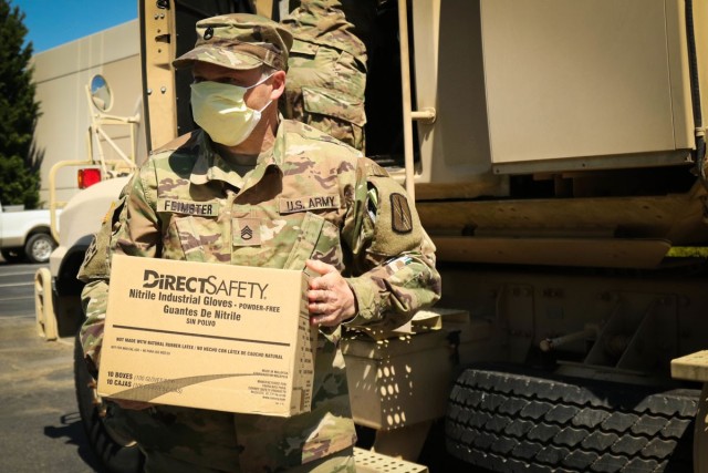 Some jobs, both military and civilian, cannot be done remotely—like welding or vehicle maintenance, medical services, and other essential positions. Thank you to those still “at the office” during this crisis! Here, North Carolina National Guardsmen Staff Sgt. Ashley Feimster delivers personal protective equipment to Emergency Management located in Western, N.C., April 10, 2020.