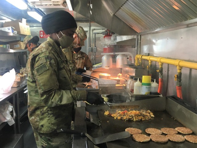 FORT CARSON, Colo. – Spc. Stephanie Straker, a culinary specialist assigned to 115th Quartermaster Field Feeding Company, 4th Sustainment Brigade, 4th Infantry Division prepares food in the Outpost Food Truck for Soldiers of the Supply Support Activity at Fort Carson, Colorado, May 8, 2020. Currently, the Soldiers operating the food truck are serving healthy meal choices to Soldiers unable to easily reach Mountain Post Ivy Warrior Restaurants during the COVID-19 pandemic. (U.S. Army photo by Staff Sgt. Scott J. Evans, 4th Infantry Division Public Affairs Office)