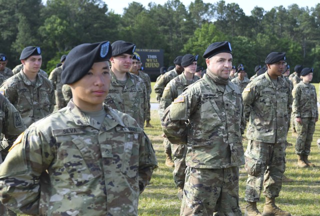 Spc. Juan Guajardo, right, a 36-year-old a Reservist from Tampa, Fla. stands in formation prior to graduating Basic Combat Training May 14 with the 4th Battalion, 39th Infantry Regiment at Fort Jackson. Guajardo is one of the first Soldiers to graduate after recovering from COVID-19.