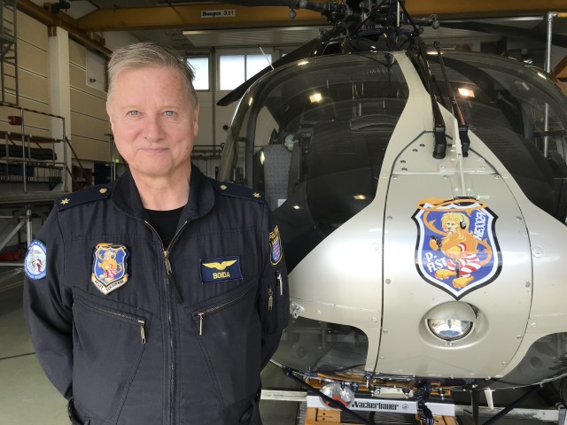 WIESBADEN, Germany - Klaus Boida, deputy director and pilot of the Polizeifliegerstaffel Hessen stands in front of his helicopter.