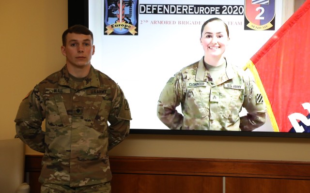 Spc. Fisher Wall, 1st Armored Brigade Combat Team, 3rd Infantry Division, left, and Sgt. Mary Cloninger, 2nd Armored Brigade Combat Team, 3rd ID, represent the division as the 3rd ID Soldier and NCO of the Year at an award ceremony on Fort...