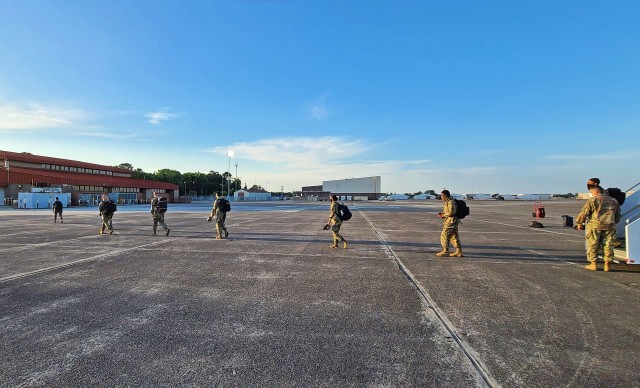 Soldiers fresh out of advanced individual training arriving from Fort Huachuca, Ariz., are guided towards their next in-processing check-point at the Truscott Air Terminal at Hunter Army Airfield, Ga., May 13, 2020. To maintain the health and...