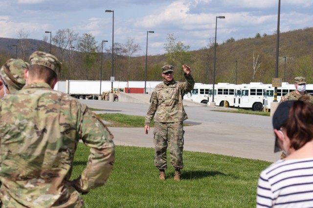 Lt. Col. George Mitroka, regimental tactical officer for fourth regiment, talks through the process for bringing back the U.S. Military Academy’s Class of 2020 Friday at the transportation motor pool. The TMP will be the first stop for all returning cadets before they are transported to Camp Buckner for COVID-19 testing.