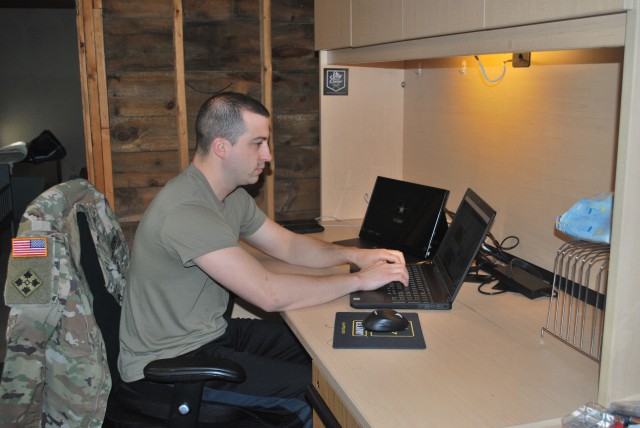 Staff Sgt. Andrew Menard continues his recruiting mission from a makeshift office in his basement. 