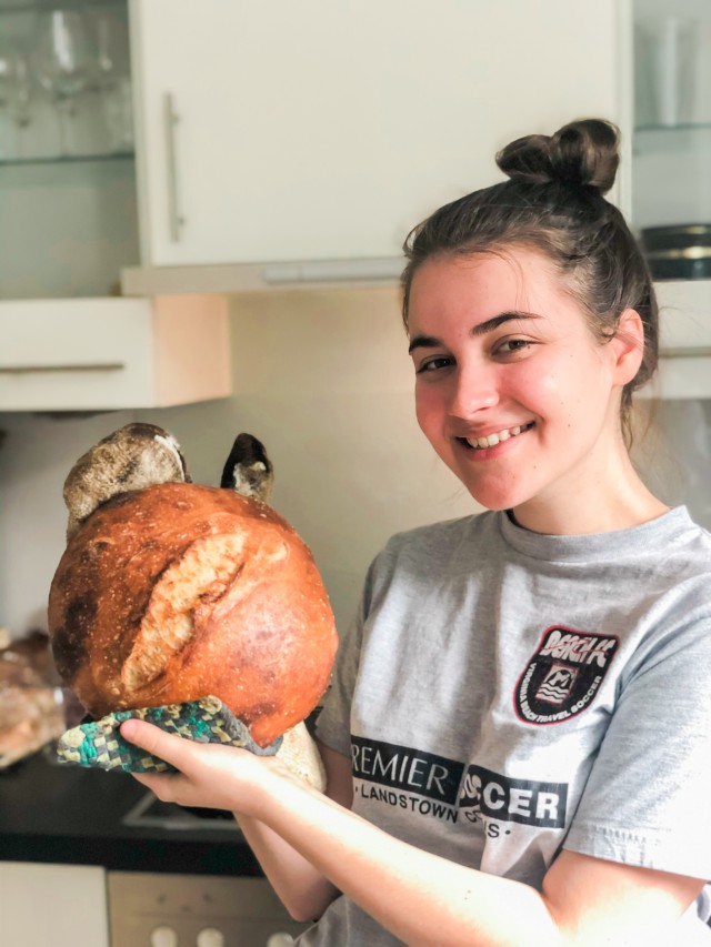 Photo courtesy of Becca Adams
Wiesbaden High School senior Becca Adams shows off a fresh loaf of sourdough bread May 1, 2020. During her extra time at home, she perfected her own recipes for the baked good.