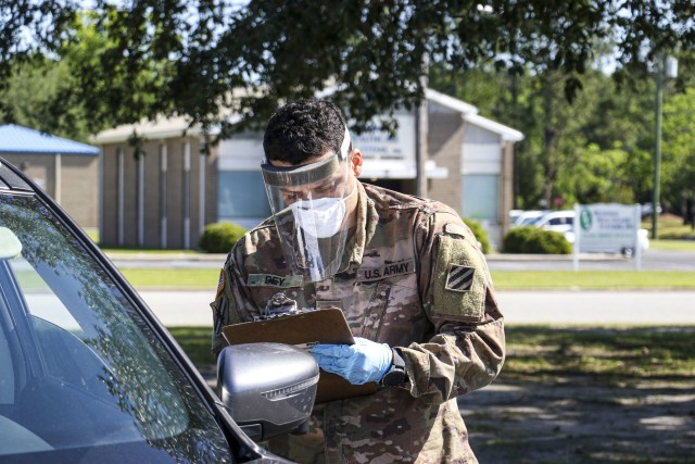 A Georgia Army National Guardsman of the Valdosta-based Company D, 2nd Battalion, 121st Infantry Regiment supports a specimen point of collection (SPOC) site at Colquitt Regional Medical Center, Moultrie, Ga. on April 28, 2020. Soldiers assist...