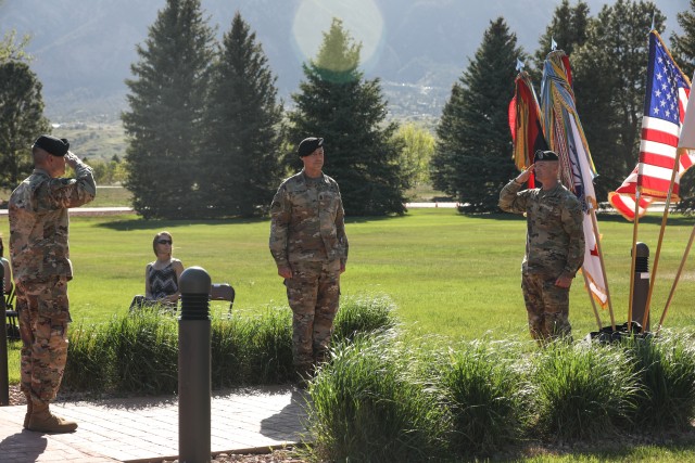 Command Sgt. Maj, TJ Holland, former senior enlisted leader of the 4th Infantry Division, salutes Maj. Gen. Matthew McFarlane, commanding general of the 4th Inf. Div. and Fort Carson, during a change of responsibility ceremony, May 18, 2020, at Manhart Field, Fort Carson. The salute symbolizes Holland turning his position over to Division Command Sgt. Maj. Adam Nash. (U.S. Army photo by Pfc. Kelsey Simmons)