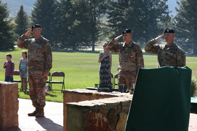 Division Command Sgt. Maj. Adam Nash, Maj. Gen. Matthew McFarlane and Command Sgt. Maj. TJ Holland salute the flag during the 4th Infantry Division change of responsibility ceremony, May 18, 2020, at Manhart Field, Fort Carson. The ceremony was held to bid farewell to Command Sgt. Maj. Holland and welcome Division Command Sgt. Maj. Adam Nash. (U.S. Army photo by Pfc. Kelsey Simmons)