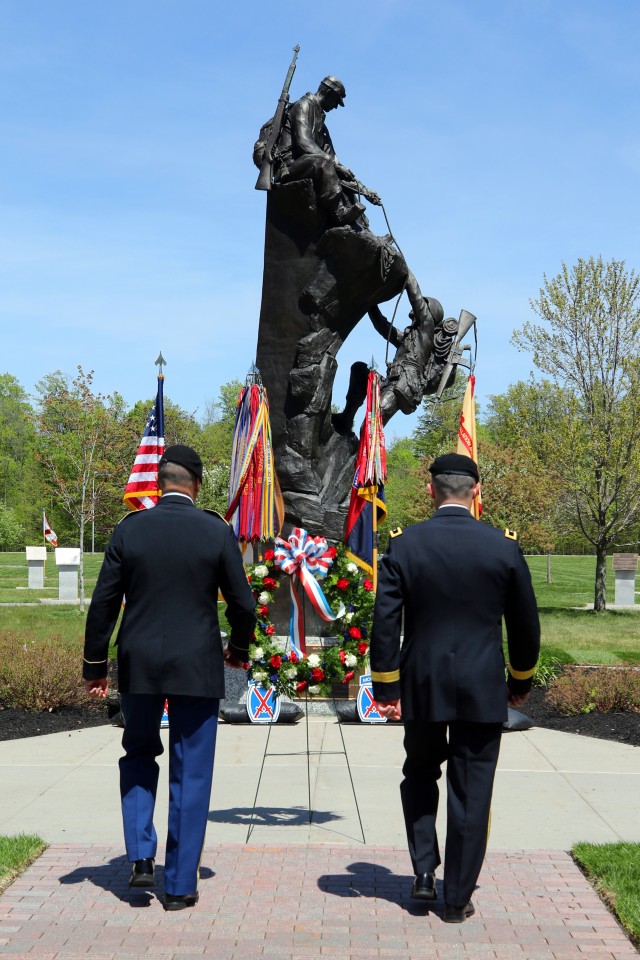 Brig. Gen. Brett Funck, 10th Mountain Division (LI) and Fort Drum&#39;s senior mission commander and Command Sgt. Maj. Mario Terenas, 10th Mountain Division&#39;s senior enlisted advisor, approach the wreath placed during the post&#39;s annual Memorial Day Ceremony on May 21, 2020. The ceremony was held to honor all of the fallen 10th Mountain Division Soldiers who gave their lives in defense of the values, liberties, and freedoms we cherish in the United States today. (U.S. Army photo by Pfc. Anastasia Rakowsky)