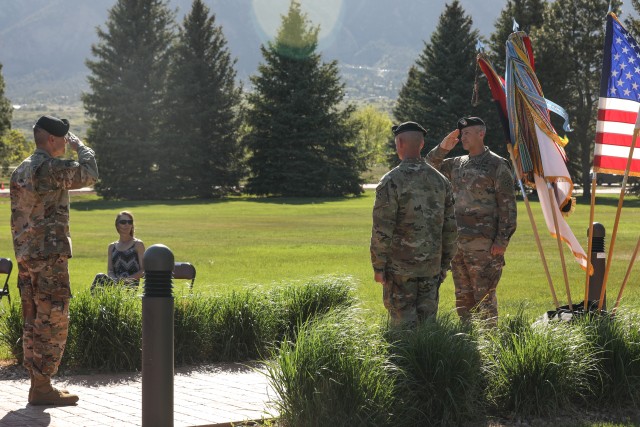 Division Command Sgt. Maj. Adam Nash, senior enlisted leader of the 4th Infantry Division, salutes Maj. Gen. Matthew McFarlane, commanding general of the 4th Inf. Div. and Fort Carson, during a change of responsibility ceremony, May 18, 2020, at Manhart Field, Fort Carson. The salute symbolizes Nash’s acceptance of his new position at the Mountain Post. (U.S. Army photo by Pfc. Kelsey Simmons)