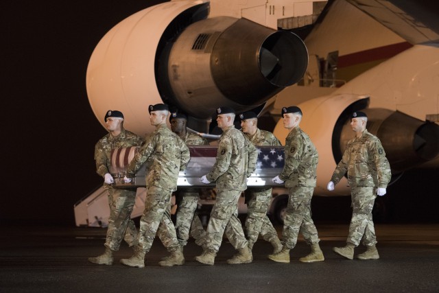 A U.S. Army carry team transfers the remains of Army Maj. Brent Taylor of Ogden, Utah, Nov. 6, 2018, at Dover Air Force Base, Del. Taylor was assigned to the Utah Army National Guard Element, Joint Force Headquarters, Draper, Utah.