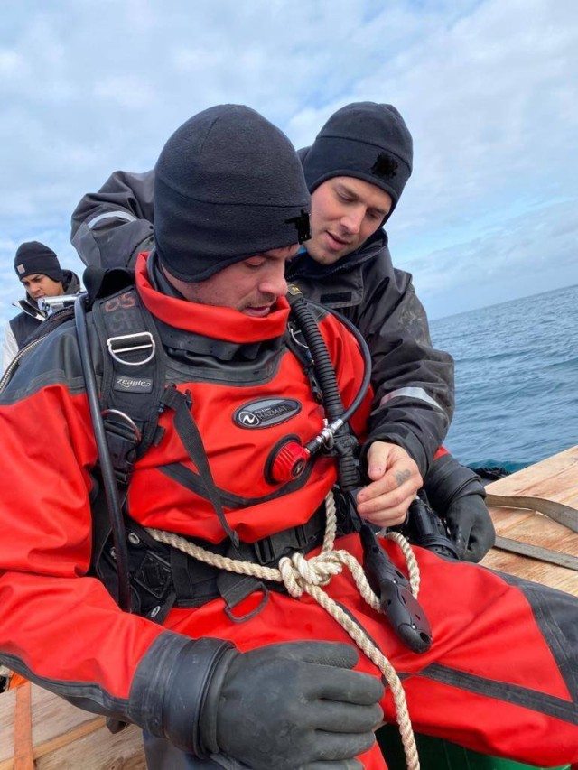 SHEMYA ISLAND, Alaska — First Class Diving Supervisor Staff Sgt. Michael Singley,  conducting pre-dive supervisor checks on Staff Sgt. Eion Audet. Members of the 7th Engineer Dive Detachment, 84th Engineering Battalion out of Joint Base Pearl...