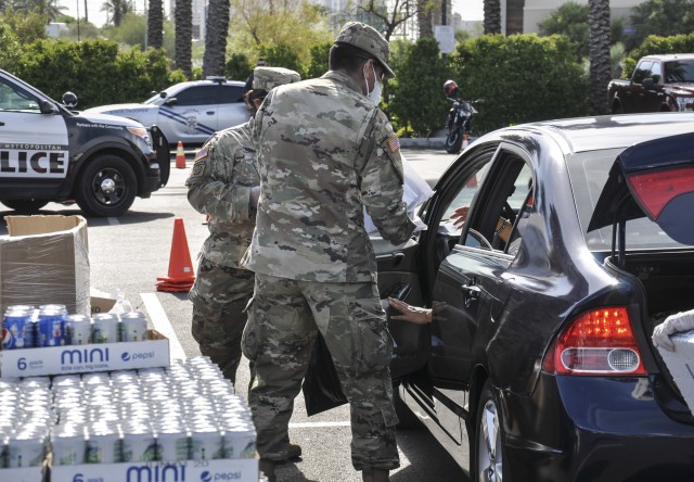 Solders with Task Force 221 with the Nevada National Guard assist Three Square with food distribution at the Palace Station Casino, Thursday, May 21, 2020 in Las Vegas, Nevada.
