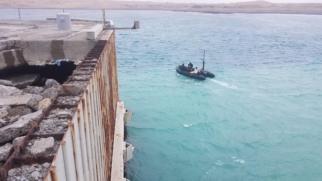 SHEMYA ISLAND, Alaska —  Staff Sergeants Jacob  Feyers, Brent Evans, Shane Van Alstyne, and Michael  Singley, on the boat, of the  7th Engineer Dive Detachment, 84th Engineering Battalion out of Joint Base Pearl Harbor, Hawaii, set out with...