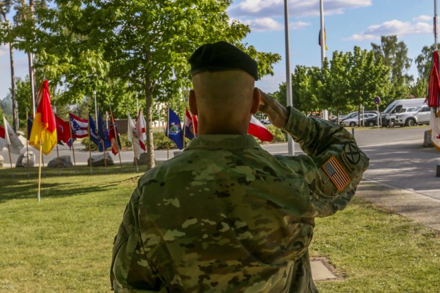 Lt. Gen. Christopher Cavoli, commanding general, U.S. Army Europe, salutes the flag after the Service with Honor ceremony in Grafenwoehr, Germany, May 21, 2020. The Service with Honor ceremony, hosted by Brig. Gen. Christopher Norrie, commanding general, 7th Army Training Command, was held to recognize senior leaders for their hard work and dedication while assigned to 7th ATC. (U.S. Army photo by Spc. zack Stahlberg)