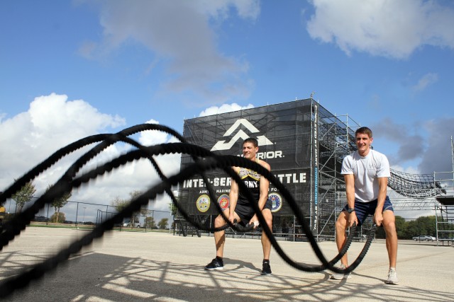 U.S. Army Lt. Col. Eric Palicia and his brother, U.S. Air Force Capt. Noah Palicia, work out on an Alpha Warrior rig at Retama Park, Selma, Texas, Sept. 10. The brothers both qualified for the chance to represent their service in the Inter-Service...