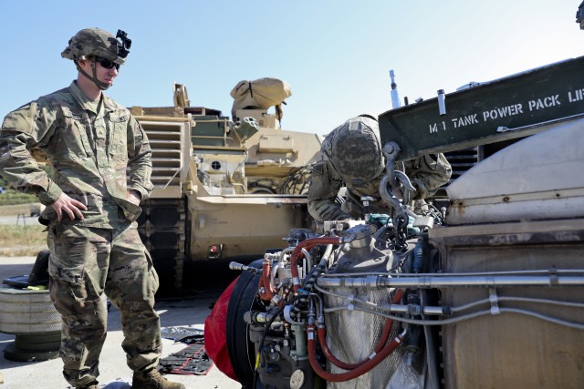 U.S. Army Sgt. Cody Fillinger and Pvt. 1st Class Matthew Chick both of 6-9 Cavalry Regiment, 3rd Armored Brigade Combat Team, 1st Cavalry Division, work to repair the engine of a M1A2 Abrams at Rodriguez Live Fire Range, Republic of Korea, Oct. 8, 2019. 3rd ABCT, 1st Cav. Div. from Fort Hood, Texas is currently on rotation to the R.O.K. (U.S. Army Photo by Staff Sgt. Jacob Kohrs, 20th PAD)