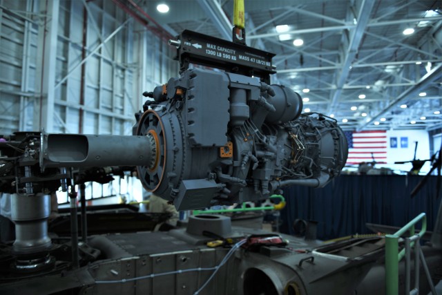 A 3D printed model of the GE T901 engine hangs from its sling waiting to be installed in an H-60M Black Hawk at Sikorsky’s West Palm Beach, FL facility.