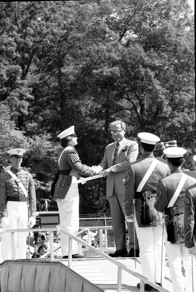 Andrea Hollen receives her diploma from Secretary of Defense Harold Brown becoming the first woman to graduate from the U.S. Military Academy. Hollen was the top ranked woman in the Class of 1980. (Photos from Signal Corps Collection, U.S. Military Academy Archives)
