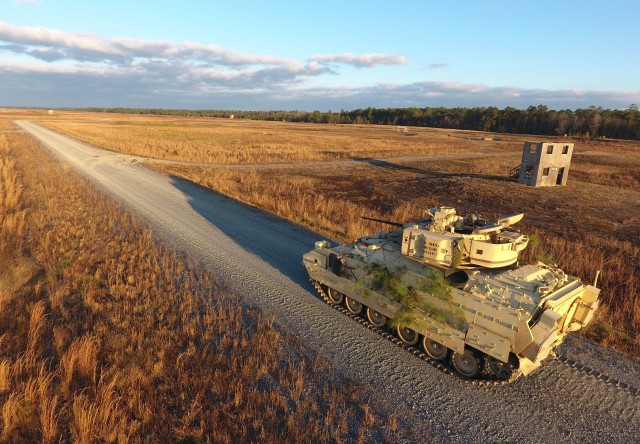 A Bradley Fighting Vehicle from the 1st Armored Brigade Combat Team, 3rd Infantry Division, conducts a Table XII gunnery at Fort Stewart, Ga., Dec. 7, 2016. The Army’s G-8 recently discussed a new strategy for the Optionally Manned Fighting Vehicle, which is expected to start replacing the Bradley in fiscal year 2028.