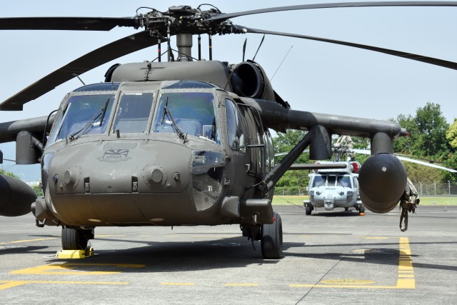 Army UH-60 Black Hawk and Navy MH-60S Sea Hawk helicopters share the same airfield at Kastner Army Heliport, Camp Zama, Japan, May 13.