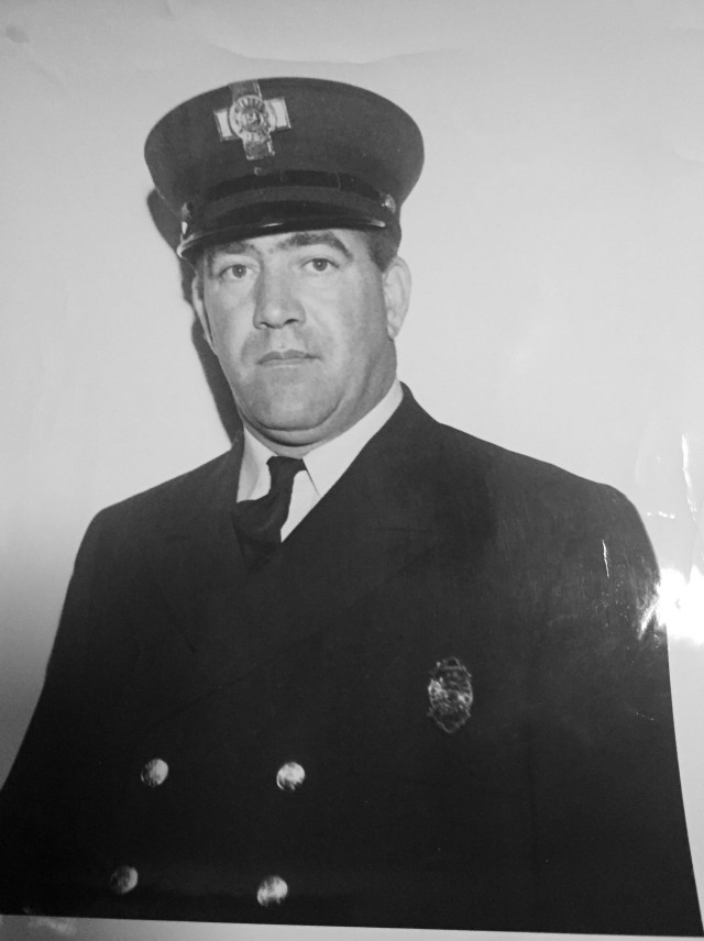 Mike Rauseo, a World War II veteran with the 1st Armored Division, poses for an official photograph in his firefighter’s uniform years after his service with the Army. Rauseo transitioned into a 20-year career as a firefighter in 1956 after serving as a Soldier, competing as a decorated athlete and working as a stonemason after the war. (Courtesy photo)