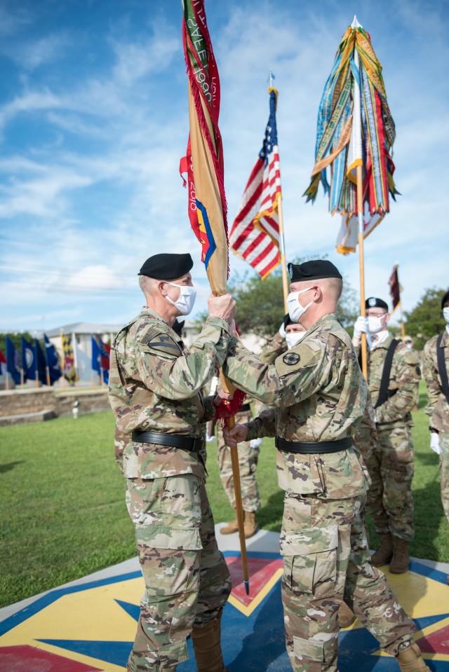 Outgoing Commanding General, Brig. Gen. Darren L. Werner, passes the colors to Maj. Gen. Scott Efflandt, Deputy Commanding General, III Corps and Fort Hood, during the ceremony May 29. Werner will now head to Michigan as the Commanding General for...