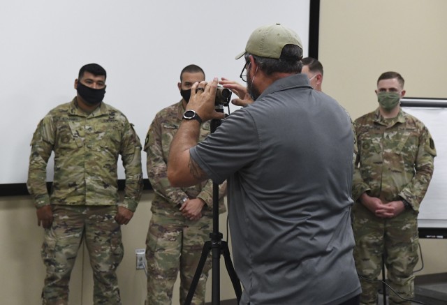 James Nelson, CACI International, shows Soldiers how to focus a thermal imaging device May 21. The device is an integral piece of the Thermal Imaging for
Fever System, or TIFS as it is commonly called. Fort Jackson is the first military installation to deploy TIFS to screen Soldiers, civilians and contractors for fever,
a leading symptom of the COVID-19 virus.