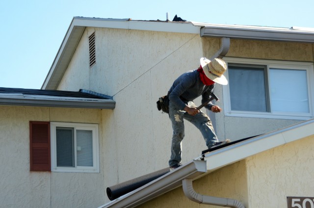 Maintenance workers fix a roof in Fort Jackson on-post housing. Fort Jackson Family Homes started fulfilling routine work orders May 18. (Photo by Ron Lester)
