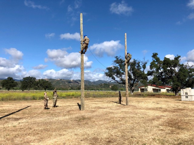Some of the tasks 25 L (Cable Systems Installer-Maintainer) Soldiers perform are climbing poles to install or repair communication lines. (Courtesy photo)
