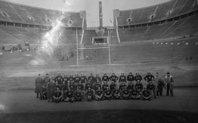 U.S. Army Soldiers participating in the Army football all-star game pose in Olympic Stadium, Berlin, Germany, prior to the all-star match held on Nov. 16, 1945. The match featured quarterback Mike Rauseo, who had also held the Army’s African middleweight boxing championship and the Army’s Italian middleweight boxing championship as he served and fought during World War II. (Courtesy photo)