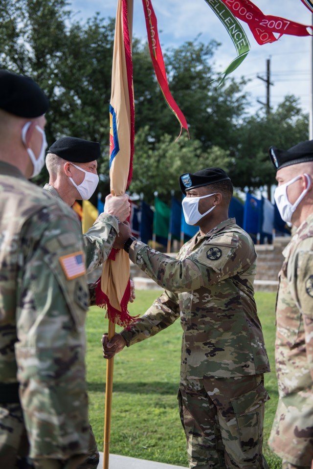 13th ESC Commanding General, Col. (P) Ronald R. Ragin, receives the colors from Maj. Gen. Scott Efflandt, Deputy Commanding General, III Corps and Fort Hood, during the ceremony May 29. Ragin takes the reins after commanding the U.S. Army...