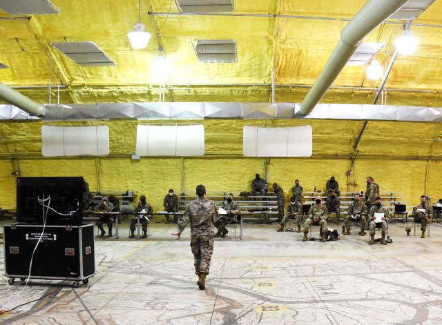 Maj. Sarah Jones, Joint Readiness Training Center Sustainment Operations Center, conducts a reception, staging, onward movement and integration rehearsal briefing for 4th SFAB Soldiers on May 27.