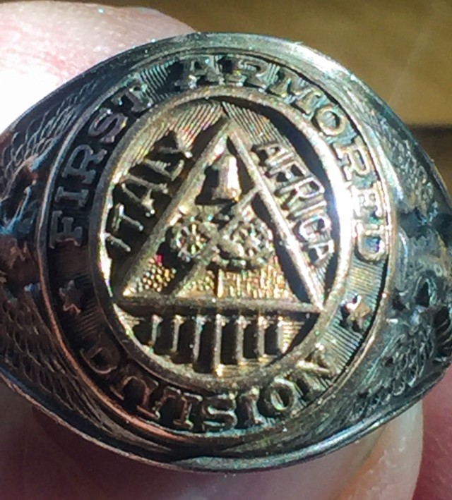 A signet ring associated with the 1st Armored Division’s participation in World War II once belonging to Mike Rauseo, a 1AD Soldier and athlete who served in Africa and Italy is displayed for a photograph on March 14, 2020. The ring was passed on to Mike’s son, Sal, who hopes that his children will continue to hold and cherish the heirloom. Items and heirlooms such as these are a reminder of the sacrifices, trials and struggles that impacted Soldiers during World War II. (Courtesy photo)