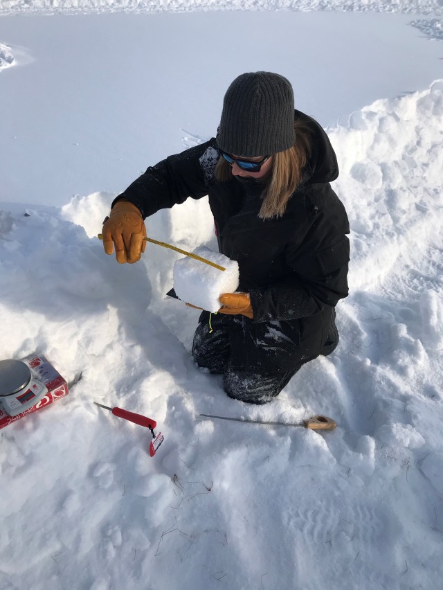Amelia Menke, engineer with the U.S. Army Corps of Engineers - Cold Regions Research and Engineering Laboratory, measures and weighs snow to determine its density. The relatively dry snow in Fairbanks is much drier due to the extreme cold than the...
