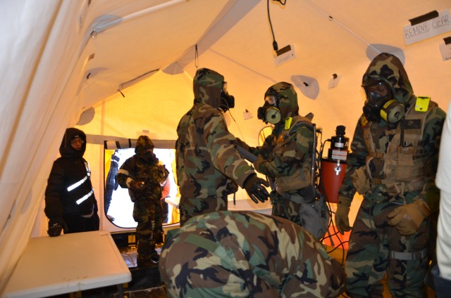 Dr. Jana Kesavan, CCDC Chemical Biological Center, observes Marines from the Chemical Biological Incident Response Force practice dry decontamination procedures in cold weather during exercise Arctic Eagle 2020. A team from CCDC CBC travelled to...