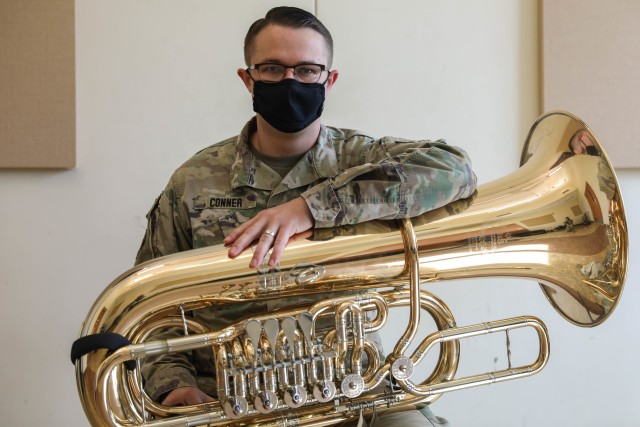 Sgt. Jacob Conner, an Army musician assigned to the 4th Infantry Division Band, sits with his tuba on his lap while wearing a face mask, May 18, 2020, on Fort Carson, Colorado. The 29-year-old, Tucson, Arizona native, is a recipient of the Finley R. Hamilton Outstanding Military Musician Award; a prestigious award that acknowledges enlisted musicians in the U.S. Army, Marine Corps, Navy, Air Force and Coast Guard.