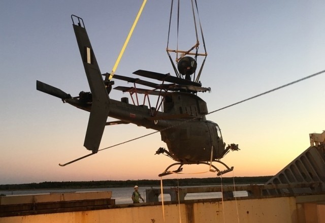 Loading of one of the six flyable aircraft into the transport ship at the port in Jacksonville, Florida. (Photo by John Zimmerman, Army Futures Command)