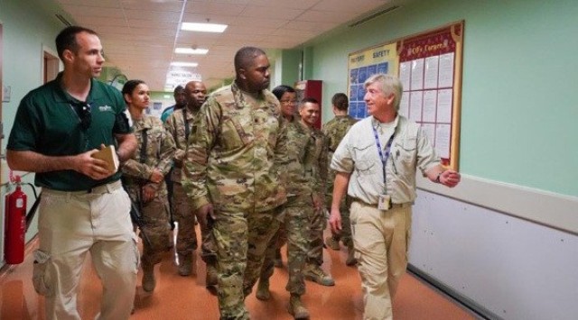 Lt. Col. Eric Brooks and Master Sgt. Rachel Harris receive a briefing during a visit to the 609th Contracting Team and DynCorp International facilities in Kandahar, Afghanistan, earlier this year. Brooks, the 919th Contracting Battalion commander, and Harris, the senior enlisted adviser, deployed the unit to in August 2019 to assume command and control of the Regional Contracting Center-Afghanistan.