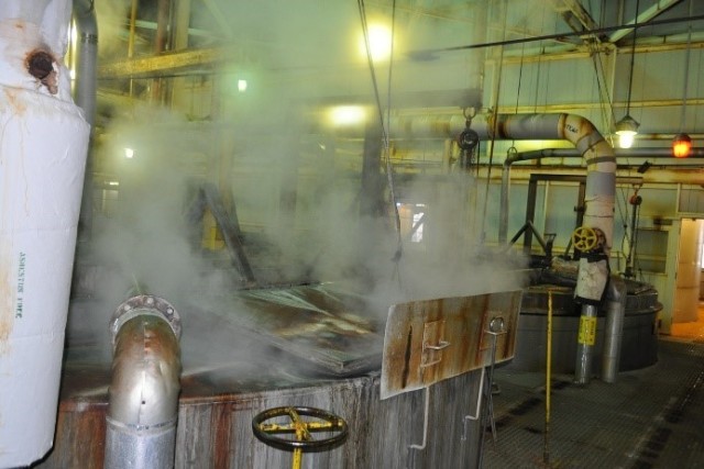 Steam releasing from an open-air boiling tub.