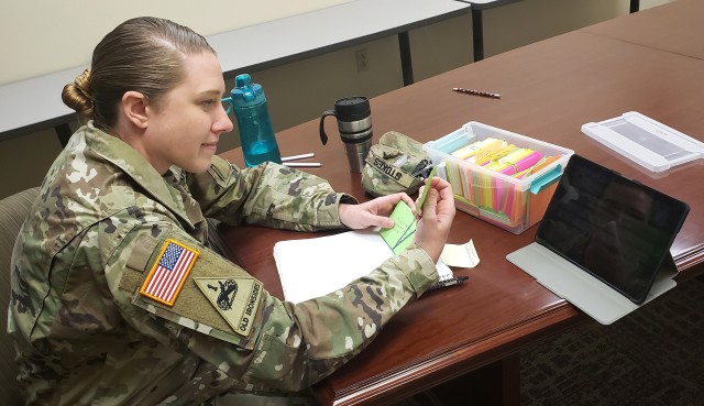 Staff Sgt. Debra Stokes studies flash cards in preparation for the virtual 2020 Army Contracting Command Best Warrior Competition May 13 at Fort Riley, Kansas. Stokes, a contract specialist with the 923rd Contracting Battalion’s 739th...