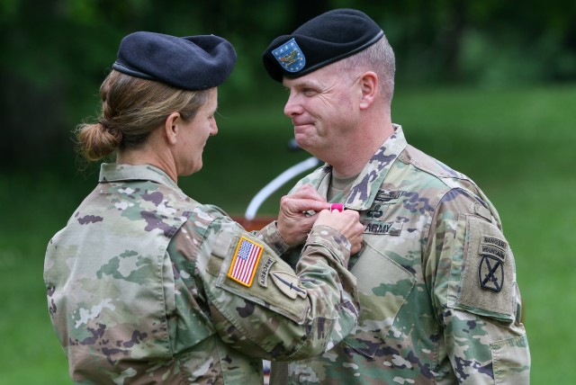 Brig. Gen. Michelle A. Schmidt, 10th Mountain Division (LI) Deputy Commanding General – Support, pins Col. Matthew S. Bresko as he is awarded with a Legion of Merit for his time served as the 10th Mountain Division (LI) Sustainment Brigade commander during a change of command ceremony held at the historic LeRay Mansion June 3, 2020, on Fort Drum, NY.
