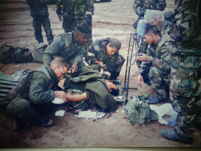 Center, now Lt. Gen. Nadja West, Army Surgeon General and Commanding General, U.S. Army Medical Command, is shown during Operation Desert Storm treating a wounded Iraqi soldier.