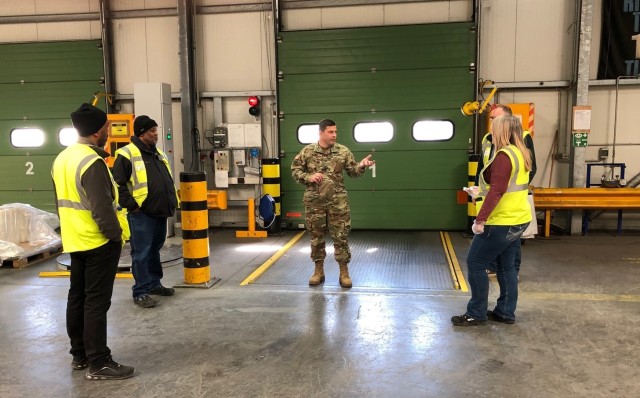 U.S. Army Garrison Rheinland-Pfalz Commander Col. Jason T. Edwards visits a Defense Commissary Agency (DeCA) warehouse and speaks with DeCA representatives April 1 at Germersheim Army Depot. 