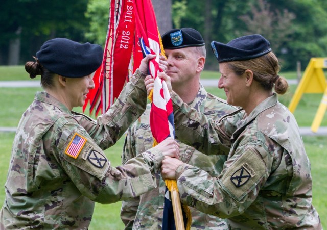 Brig. Gen. Michelle A. Schmidt, 10th Mountain Division (LI) Deputy Commanding General – Support, passes the 10th Mountain Division (LI) Sustainment Brigade Colors to Col. Erin Miller during a change of command ceremony held at the historic LeRay Mansion June 3, 2020, on Fort Drum, NY.