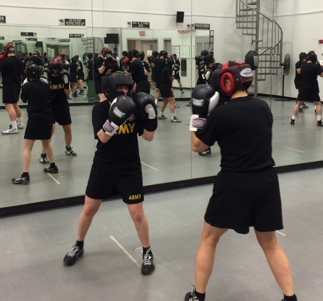 Then Brig. Gen. Diana Holland, and Command Sgt. Maj. Dawn Rippelmeyer  take part in a boxing class the first year that the course became mandatory for female cadets.