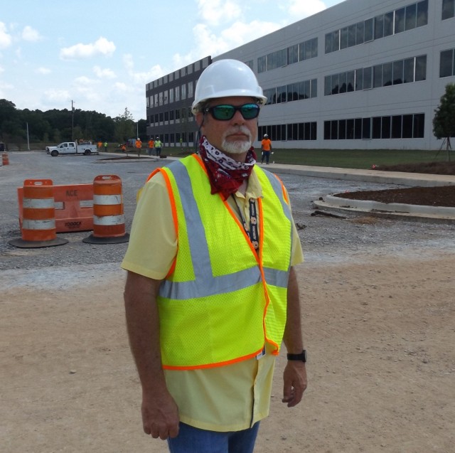Philip Cook, deputy division chief of Intelligence and Security for the Program Executive Office – Missiles and Space, stands outside a new PEO MS facility under construction near Gate 9 on Redstone Arsenal. The new facility will allow the PEO...