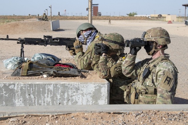 Staff Sgt. Sean Eckrote, assigned to Bravo Battery, 1st Battalion, 158th Field Artillery Regiment, Oklahoma Army National Guard, fires an M240B machine while Spc. Maison Millan (left) 1-158 Field Artillery, and Sgt. 1st Class Zachary Hermes...