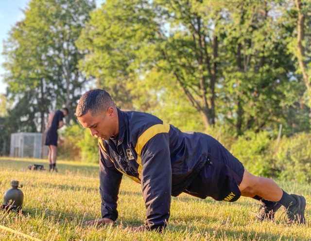 RHINE ORDNANCE BARRACKS, Germany - Staff Sgt. Ian Ledesma, a patriot section chief assigned to Alpha Battery, 5th Battalion, 7th Air Defense Artillery Regiment conducts the hand release push-up during a physical fitness challenge on Rhine Ordnance...